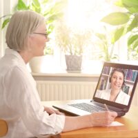 senior woman laptop online therapy