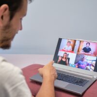 Man pointing at a person on a videocall therapy session. Distance therapy concept.